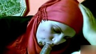 Muslim woman wearing hijab sucking and jacking cock